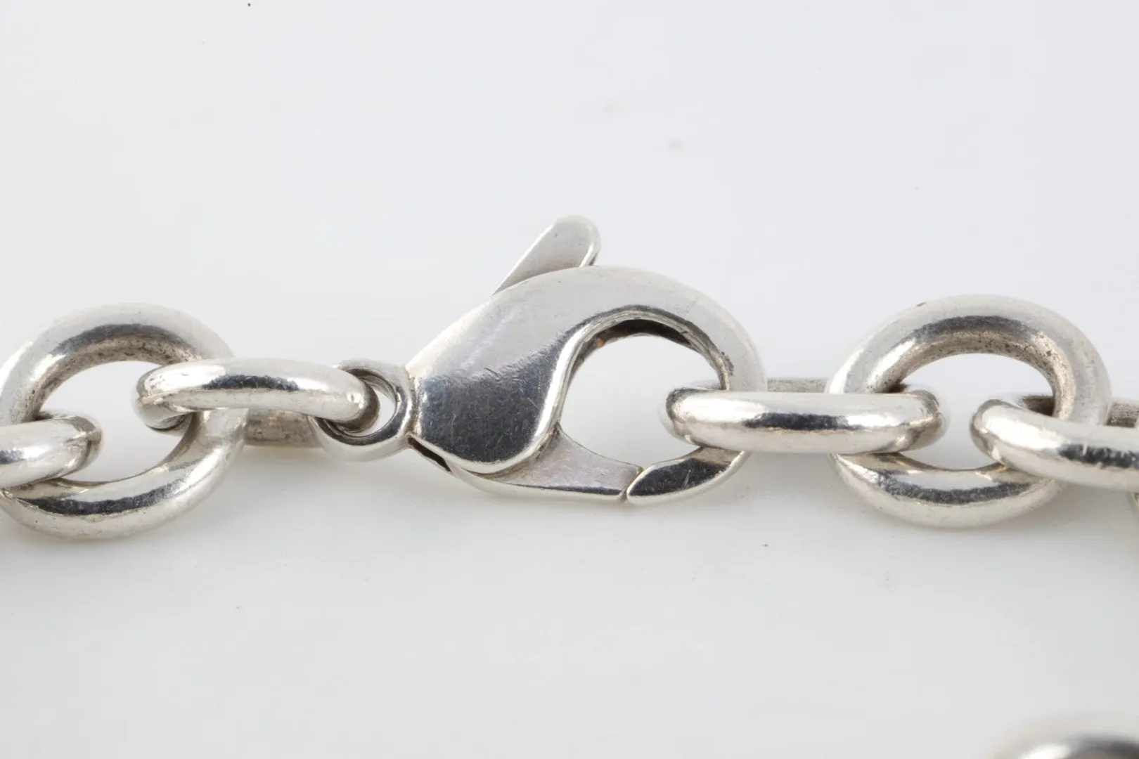 7.5" Tiffany & Co. 925 Silver Dice Charm Bracelet (40.23g.)